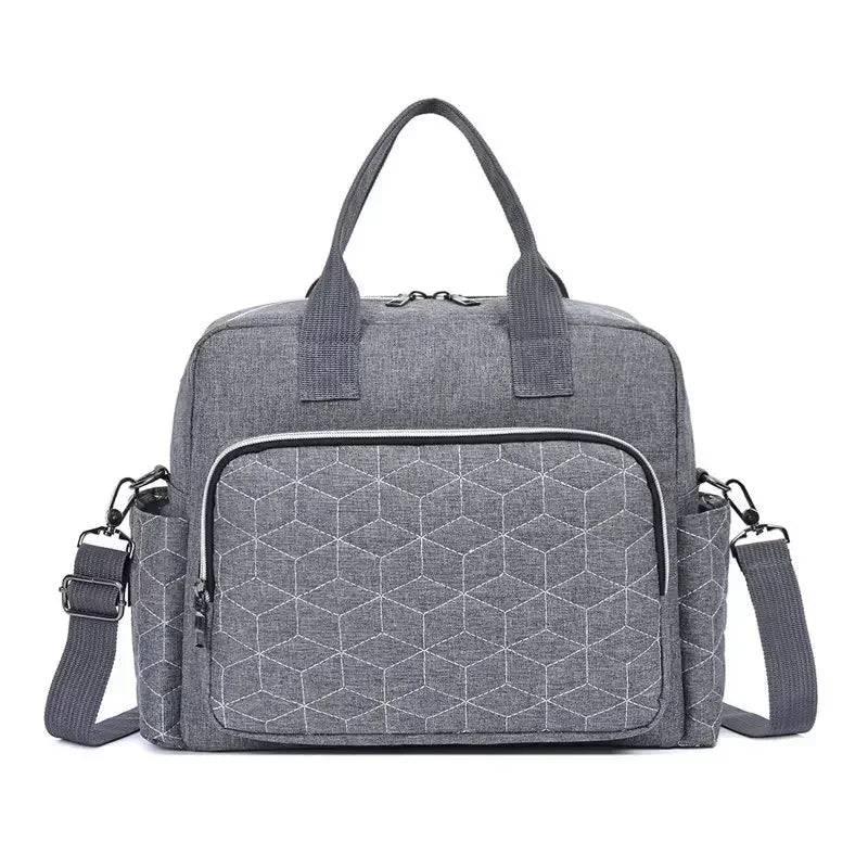Sac à langer gris élégant et compact pour parents modernes